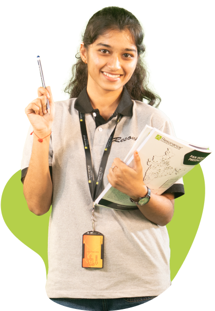Smiling student holding notes and pen